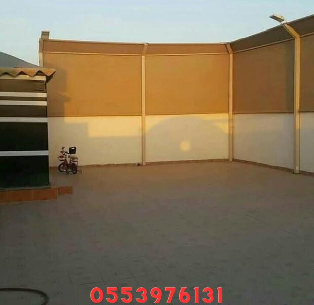 فني تركيب سواتر قماش للحوش